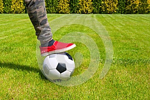 Soccer ball and leg close-up. Sport lifestyle