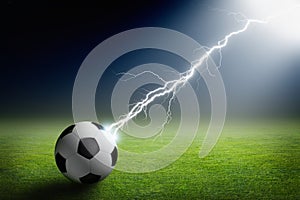 Soccer ball, lightning, spotlight