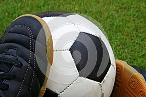 A soccer ball and a pair of shoes