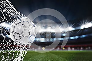 Soccer ball scores a goal on the net. 3D Rendering photo