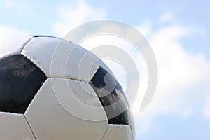 Soccer ball in sky.
