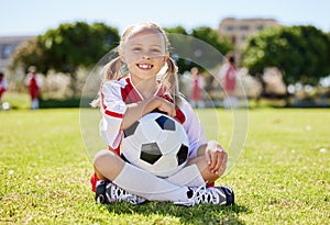 Soccer ball, sports girl and field sitting, training for youth competition match playing at stadium grass. Portrait