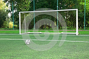 Soccer ball on stadium field