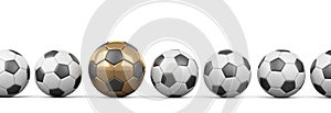 Soccer balls in a row, one of them is golden