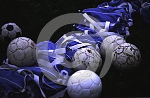 Soccer balls sitting out for practice before the game