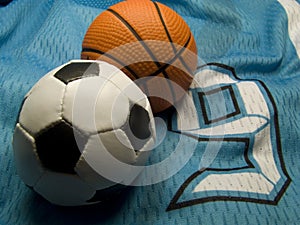 Soccer and basketball bals on the uniform