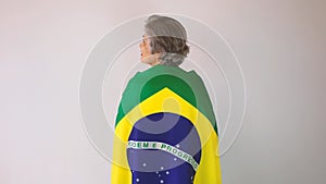 Soccer Black Man Fan or Player With Yellow Shirt and Brazil Flag Celebrating the Cup Isolated on White