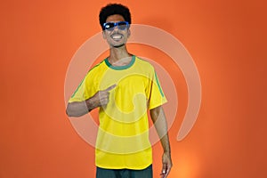 Soccer Brazilian  Fan Celebrating Isolated on Orange Background