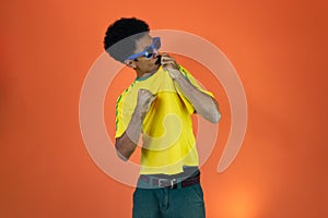 Soccer Brazilian  Fan Celebrating Isolated on Orange Background