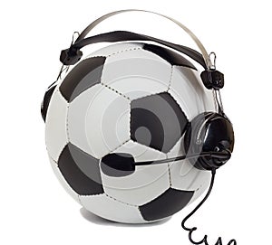 Soccer concept, ball in headphones as commentator photo