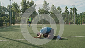 Soccer defender committing foul against football striker on pitch