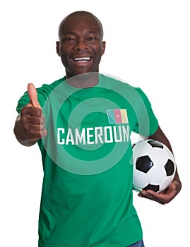 Soccer fan from Cameroon with Football showing thumb up