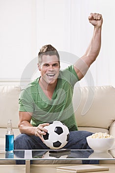 Soccer Fan Pumping His Fist in Celebration