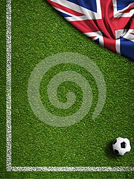 Soccer field with ball and flag of United Kingdom