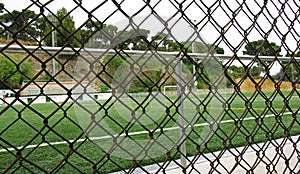 Soccer field behind the barbed wire of TurÃ³ de la Peira, Barcelona