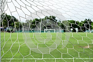 Soccer field from behind goal net