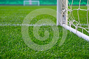 Soccer field with green grass. Football goal on stadium arena.