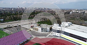 A soccer field with perfect green grass. Football field with treadmill around