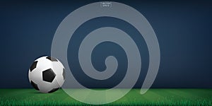 Soccer football ball on green grass of soccer field or football field stadium background. Vector