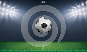 Soccer football ball and green grass of soccer field stadium background. Vector