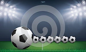 Soccer football ball and green grass of soccer field stadium background. Vector