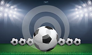 Soccer football ball and green grass of soccer field stadium background. Vector