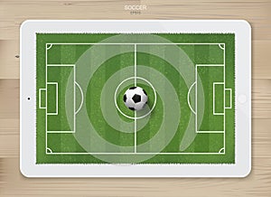 Soccer football ball in soccer field area on tablet display.