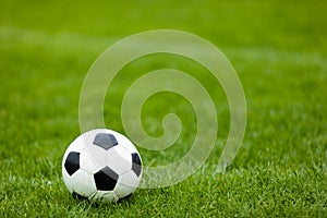 Soccer Football Ball on Soccer Field. Green Grass Soccer Pitch