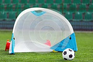 Soccer Football Ball and Soccer Goal For Children. Sports Soccer Equipment on Grass Stadium Venue