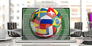 Soccer football ball with world flags on a computer keyboard, blur office background. 3d illustration