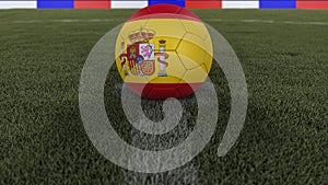 Soccer / football classic ball in the center of the field grass with painting of the Spain flag with depth of field defocused, 3D