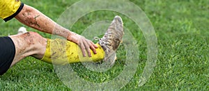 Soccer, football concept. Injured footballer lay down on field