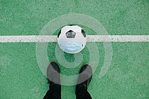 Soccer football with face mask for sports during covid-19 pandemic