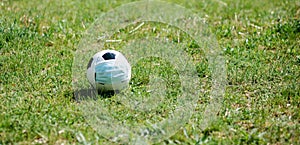 Soccer football with face mask for sports during covid-19 pandemic