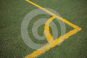 Soccer (football) field corner with yellow lines