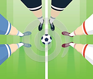 Soccer / Football Field With Players Foots In Boots. Referee With Two Players Top View. Long Perspective.