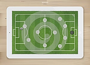 Soccer football game formation tactics on touch screen tablet background.