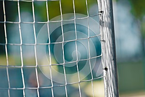 Soccer Football Goal With Net. Football Pitch Field With Stadium in the Background