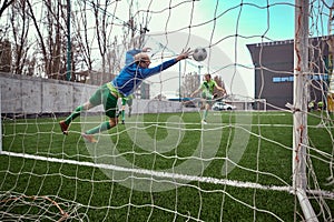 Soccer football goalkeeper making diving save