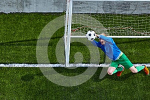 Soccer football goalkeeper making diving save