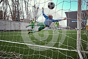 Soccer football goalkeeper making diving save