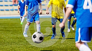 Soccer Football Match. Kids Playing Soccer. Young Boys Kicking Football Ball on the Sports Field