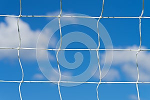 Soccer football net with blue sky and white clouds background