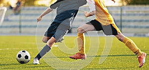 Soccer Football Players Compete at the Stadium. Two Footballers Running and Kicking Soccer Ball. Football Match Background