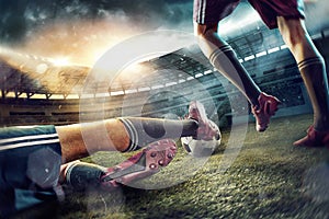 The soccer football players at the stadium in motion