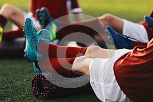 Soccer Football Players in a Team on Fitness Workout to Relieve Muscle Tightness, Soreness, and Inflammation