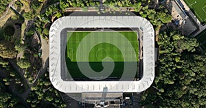 Soccer football stadium top down overhead Aerial in forrest park. Green grass landmark landscape architecture structure