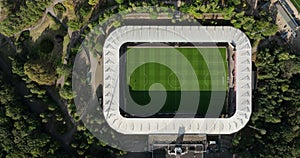 Soccer football stadium top down overhead Aerial in forrest park. Green grass landmark landscape architecture structure