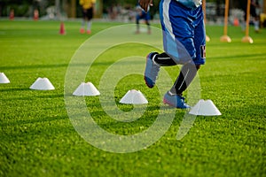 Soccer Football Training Session for Kids. Boys Training Football on the Pitch. Soccer Stadium in the Background.