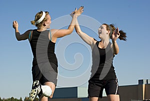 Soccer Girls celebrate with a high five